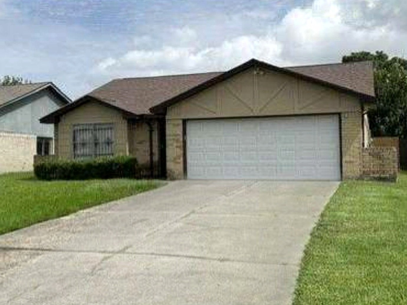 Front elevation of the Bamboo Forest Trail residence in Houston, Texas, rebuilt and leased by REPCA
