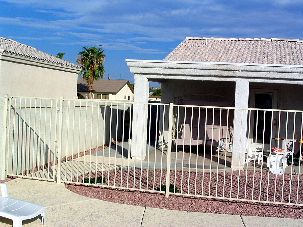 Covered patio and pool enclosure at Caravelle Drive